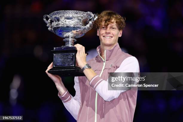 Jannik Sinner of Italy poses with the Norman Brookes Challenge Cup during the official presentation after their Men's Singles Final match against...