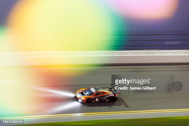 The Pfaff Motorsports McLaren 720S GT3 EVO of Marvin Kirchhöfer, Oliver Jarvis, James Hinchcliffe and Alexander Rossi drives during the Rolex 24 at...
