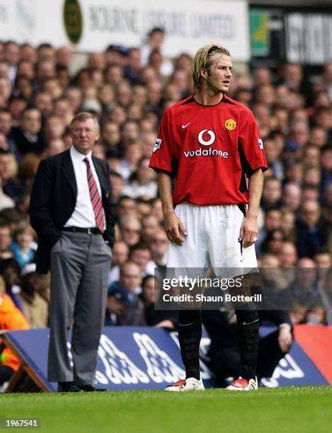 David Beckham of Manchester United and his manager Sir Alex Ferguson look in different directions during the FA Barclaycard Premiership match between...