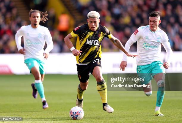 Matheus Martins of Watford runs with the ball whilst under pressure from Carlos Alcaraz of Southampton during the Emirates FA Cup Fourth Round match...