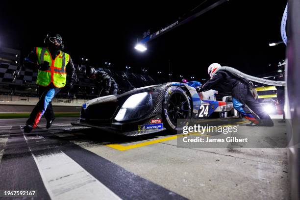 The BMW M Team RLL BMW M Hybrid V8 of Jesse Krohn, Philipp Eng, Augusto Farfus and Dries Vanthoor pits during the Rolex 24 at Daytona International...