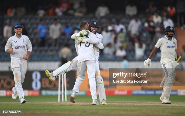 England wicketkeeper Ben Foakes celebrates with Tom Hartley after taking the final wicket during day four of the 1st Test Match between India and...