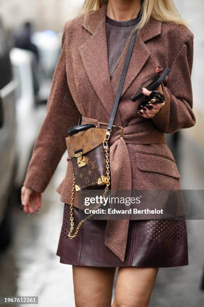 Guest wears a blazer jacket a brown leather Vuitton bag, a brown leather mini skirt, outside Georges Hobeika, during the Haute Couture Spring/Summer...