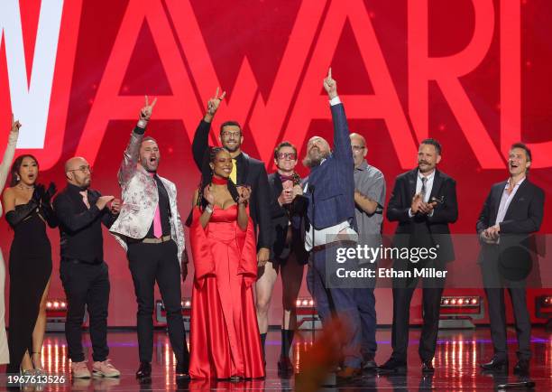Kira Noir and Ricky Greenwood accept the Grand Reel award for "Machine Gunner" during the 2024 Adult Video News Awards at Resorts World Las Vegas on...