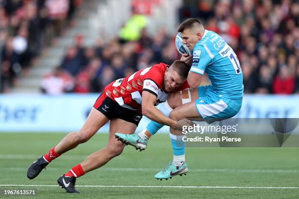 Joe Carpenter of Sale Sharks is tackled by Chris Harris of Gloucester Rugby during the Gallagher Premiership Rugby match between Gloucester Rugby and...