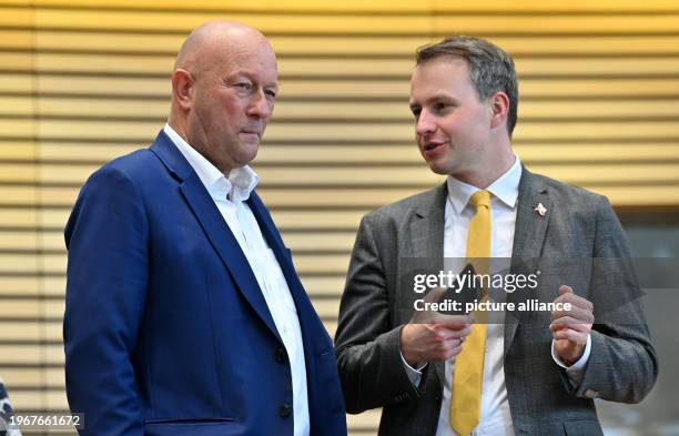 January 2024, Thuringia, Erfurt: Thomas Kemmerich and Andreas Bühl , MPs, talk to each other in the plenary chamber of the Thuringian state...