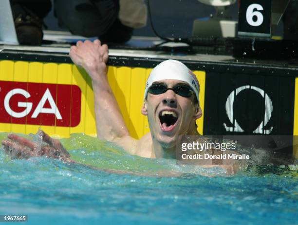 Michael Phelps reacts to missing the World Record in the 100M Butterfly by less than .10 seconds in the Men's 100M Butterfly during the Duel in the...