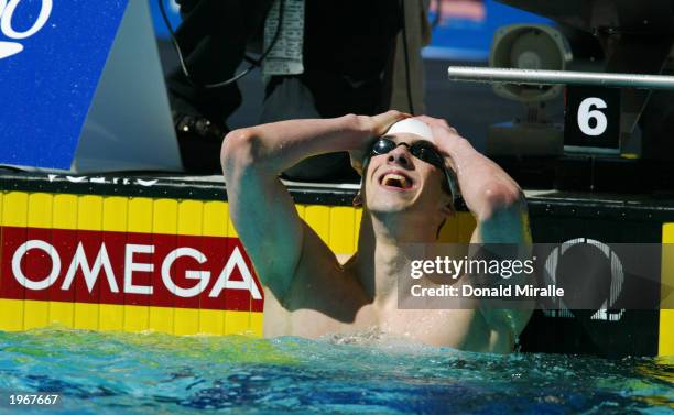 Michael Phelps reacts to missing the World Record in the 100M Butterfly by less than .10 seconds in the Men's 100M Butterfly during the Duel in the...