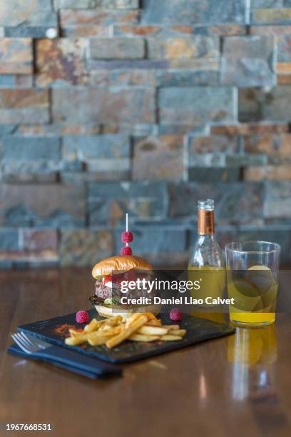 hamburger and french fries and orange soda - hamburguesa stock-fotos und bilder