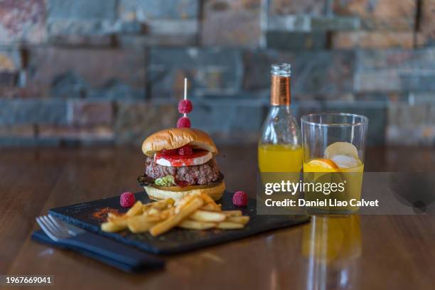 hamburger and french fries and orange soda - hamburguesa stock-fotos und bilder