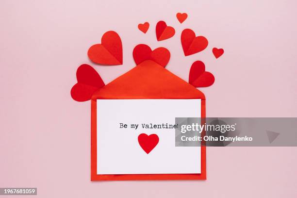 be my valentine card with red envelope and paper hearts on pink backgrount. happe st. valentine day - red card envelope stock pictures, royalty-free photos & images