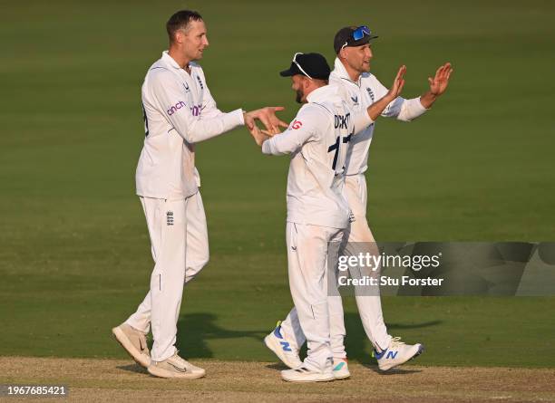 England bowler Tom Hartley celebrates with Ben Duckett after taking his 5th wicket of the innings during day four of the 1st Test Match between India...