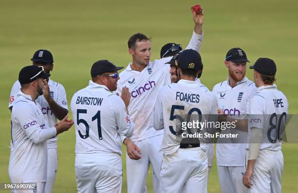 England bowler Tom Hartley celebrates by holding aloft the match ball after taking his 5th wicket of the innings during day four of the 1st Test...