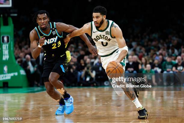 Boston, MA Boston Celtics SF Jayson Tatum drives past Indiana Pacers SF Aaron Nesmith in the second quarter. The Celtics beat the Pacers, 129-124.