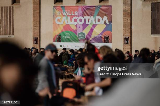 Dozens of people eat calçots, on January 28 in Valls, Tarragona, Catalonia, Spain. The last Sunday of January is celebrated in Valls the Great Feast...