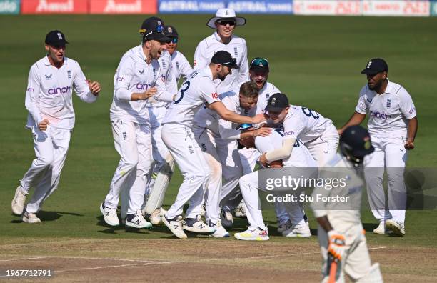 England captain Ben Stokes celebrates with team mates after his throw had run out India batsman Ravindra Jadeja during day four of the 1st Test Match...