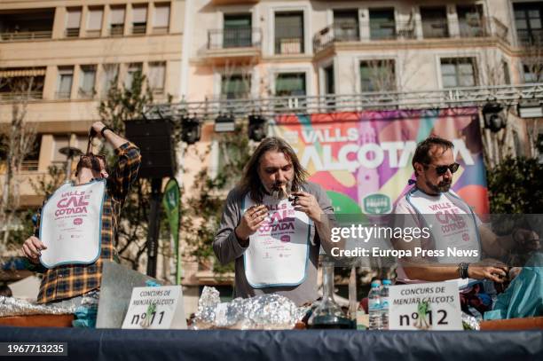 Men participate in a calçot eating contest on January 28 in Valls, Tarragona, Catalonia, Spain. On the last Sunday of January, the Gran Fiesta de la...