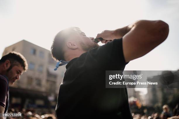 Man participates in a calçot eating contest, on January 28 in Valls, Tarragona, Catalonia, Spain. On the last Sunday of January, the Gran Fiesta de...