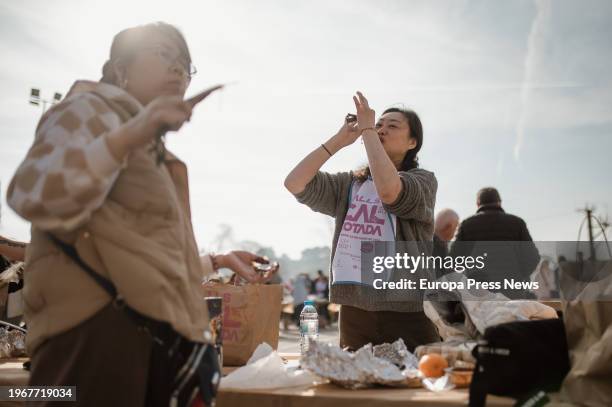 Two women eat calçots, on January 28 in Valls, Tarragona, Catalonia, Spain. The last Sunday of January is celebrated in Valls the Great Feast of the...