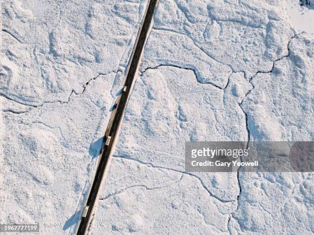 elevated view over road in frozen winter wilderness - looking down road stock pictures, royalty-free photos & images