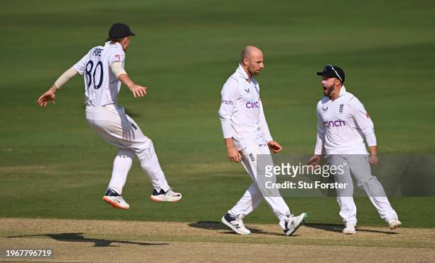England bowler Jack Leach celebrates with team mates Ollie Pope and Ben Duckett after taking the wicket of Shreyas Iyer during day four of the 1st...