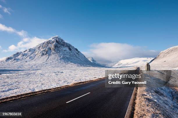 road leading into the distance in frozen winter landscape - grampians stock pictures, royalty-free photos & images