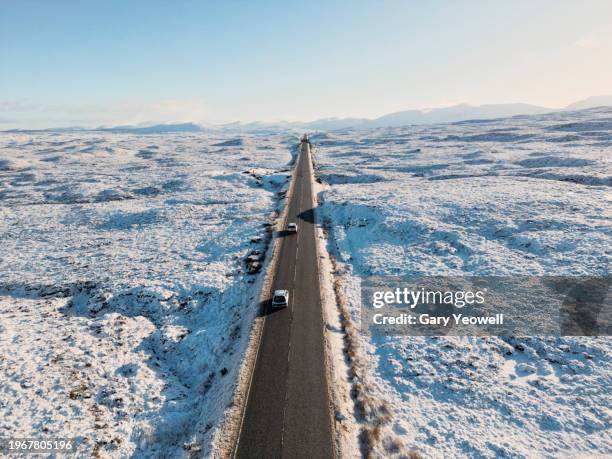 road leading into the distance in frozen winter landscape - grampians stock pictures, royalty-free photos & images