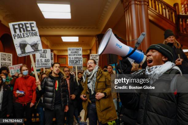 Cambridge, MA Kojo Acheampong, a Harvard student and member of AFRO , speaks to Pro-Palestine supporters in the lobby of Cambridge City Hall before...