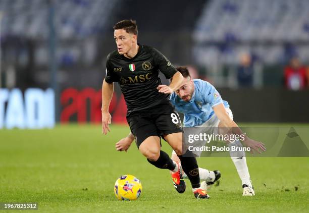 Giacomo Raspadori of SSC Napoli runs with the ball whilst under pressure from Mario Gila of SS Lazio during the Serie A TIM match between SS Lazio...