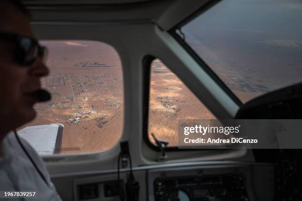 View of the UAE city of Al Ain during a cloud-seeding mission on January 31, 2024 in Al Ain, United Arab Emirates. Cloud seeding is a weather...