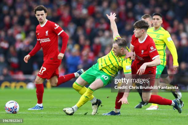 James McConnell of Liverpool in action with Ashley Barnes of Norwich City during the Emirates FA Cup Fourth Round match between Liverpool and Norwich...