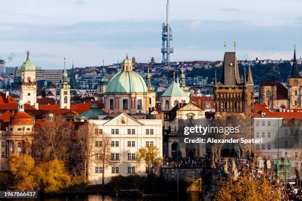 prague cityscape with stare mesto (old town) in foreground and zizkov tv tower in background, czech republic - czech republic river stock pictures, royalty-free photos & images