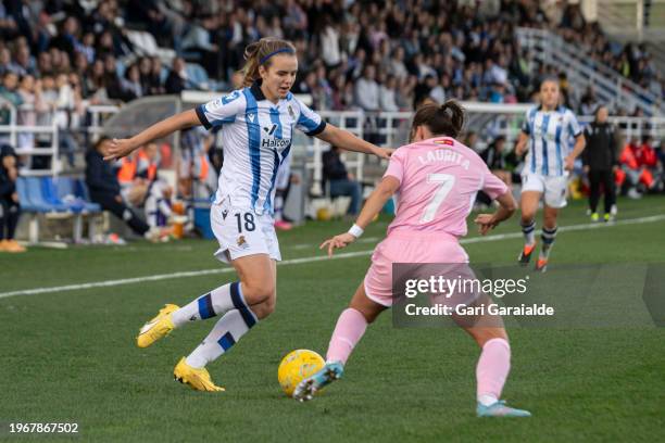 Mirari Uria of Real Sociedad vies with Laura Dominguez of Madrid CFF during the Primera Division Femenina match between Real Sociedad and Madrid CFF...