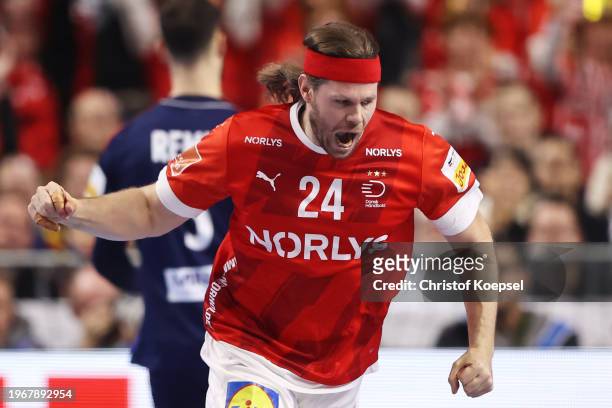Mikkel Hansen of Denmark celebrates a goal during the Men's EHF Euro 2024 final match between Denmark and France at Lanxess Arena on January 28, 2024...