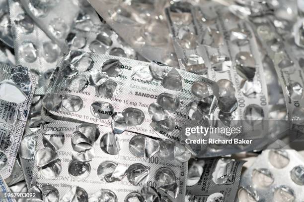 Detail of silver medication foils that once contained 10mg Amlodipine tablets, treatments and pharmaceutical products by the Sandoz brand, on 31st...
