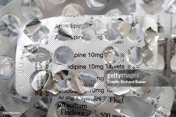 Detail of silver medication foils that once contained 10mg Amlodipine tablets, treatments and pharmaceutical products by the Sandoz brand, on 31st...