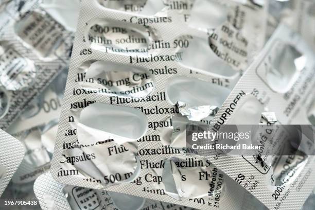 Detail of silver medication foils that once contained 500mg Flucloxacillin capsules pharmaceutical products, on 31st January 2024, in London,...