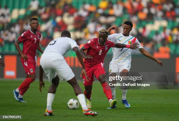 Jannick Buyla Sam of Equatorial Guinea and Morgan Bono Guilavogui of Guinea during the TotalEnergies CAF Africa Cup of Nations round of 16 match...