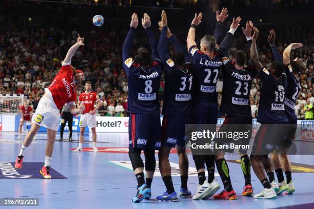 Mikkel Hansen of Denmark takes a free throw in the last second during the Men's EHF Euro 2024 final match between Denmark and France at Lanxess Arena...