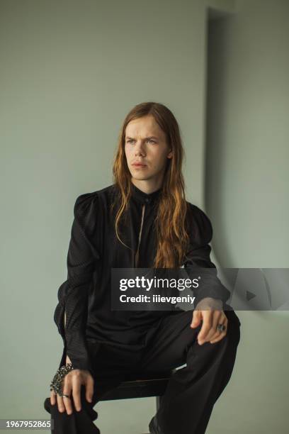 long hair man in studio. gothic style - emo-blonde-hair stock pictures, royalty-free photos & images