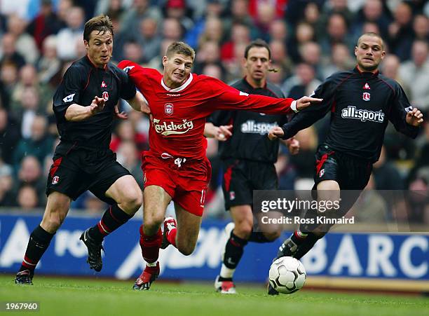 Steven Gerrard of Liverpool takes the ball past Scott Parker of Charlton Athletic during the FA Barclaycard Premiership match between Liverpool and...