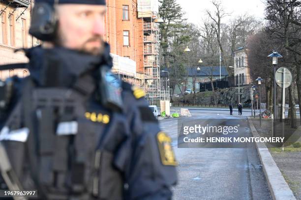 Police officers are seen outside the Israeli embassy in Stockholm, January 31, 2024. A hand grenade was found near the Israeli embassy in Stockholm,...