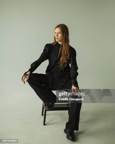 long hair man in studio. gothic style - emo guy stock pictures, royalty-free photos & images