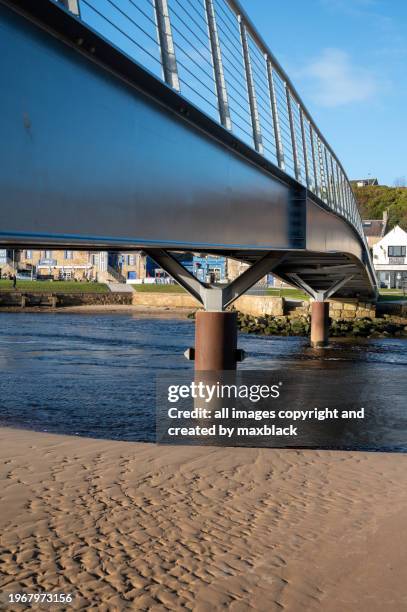 river lossie flowing under lossiemouth footbridge. - steel railings stock pictures, royalty-free photos & images