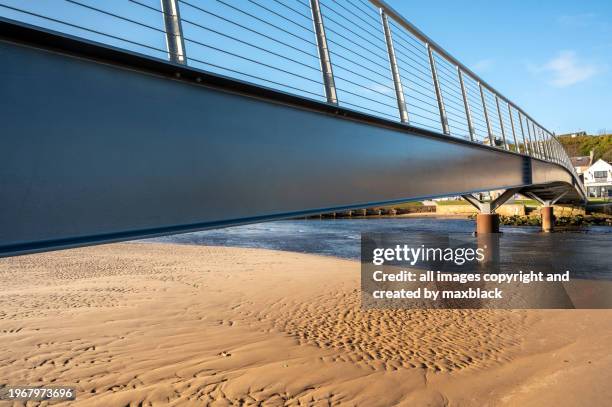 footbridge crossing the river lossie-lossiemouth. - steel railings stock pictures, royalty-free photos & images