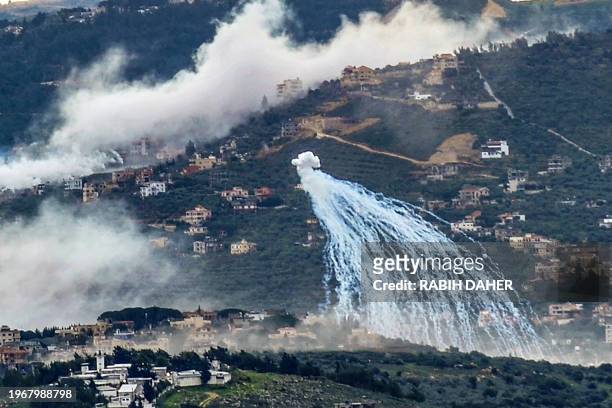 Smoke billows during Israeli shelling on the southern Lebanese village of Kfar Kila near the border with Israel on January 31 amid ongoing...
