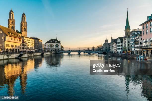 skyline of zürich with limmat and grossmünster - zurich stock pictures, royalty-free photos & images