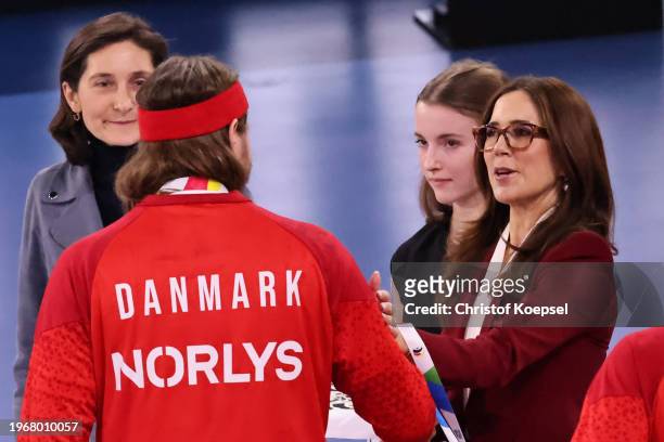 Queen Mary of Denmark interacts with Mikkel Hansen after during the Men's EHF Euro 2024 final match between Denmark and France at Lanxess Arena on...