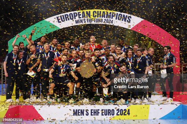 Luka Karabatic of France lifts the trophy after the team's victory in the Men's EHF Euro 2024 final match between Denmark and France at Lanxess Arena...