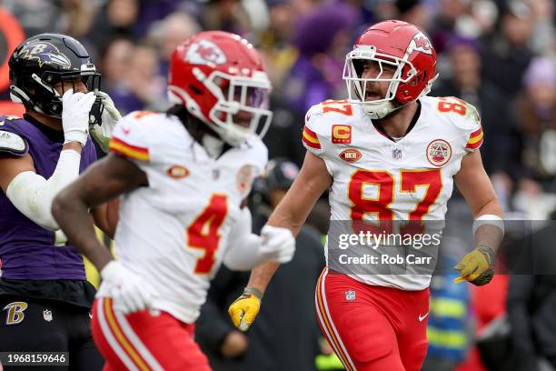 Travis Kelce of the Kansas City Chiefs celebrates after catching a touchdown pass against the Baltimore Ravens during the first quarter in the AFC...